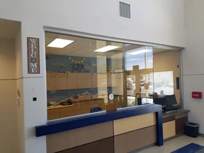 Sliding glass transaction window